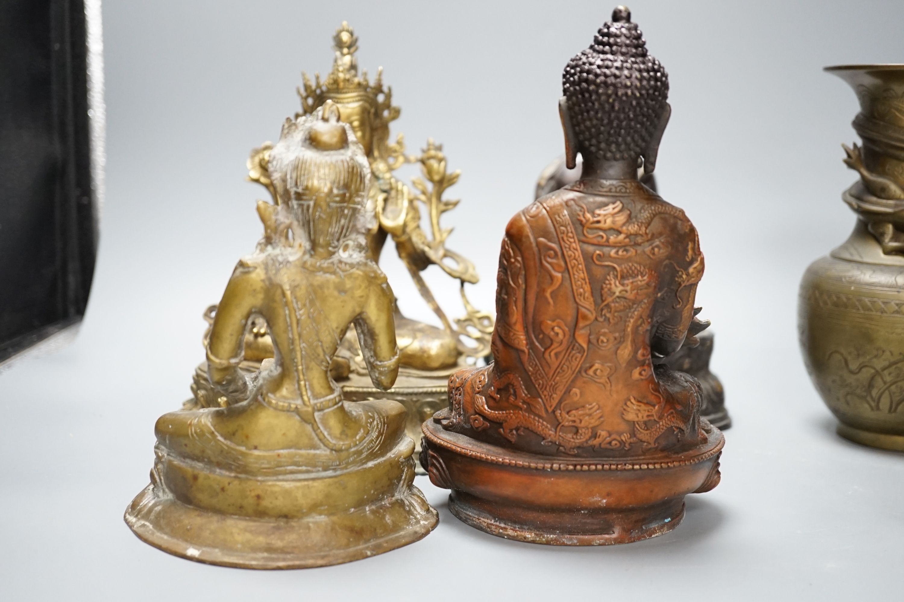 A group of five Tibetan or buddhist bronzes of deities and a Chinese bronze ‘dragon’ vase, tallest 21cm